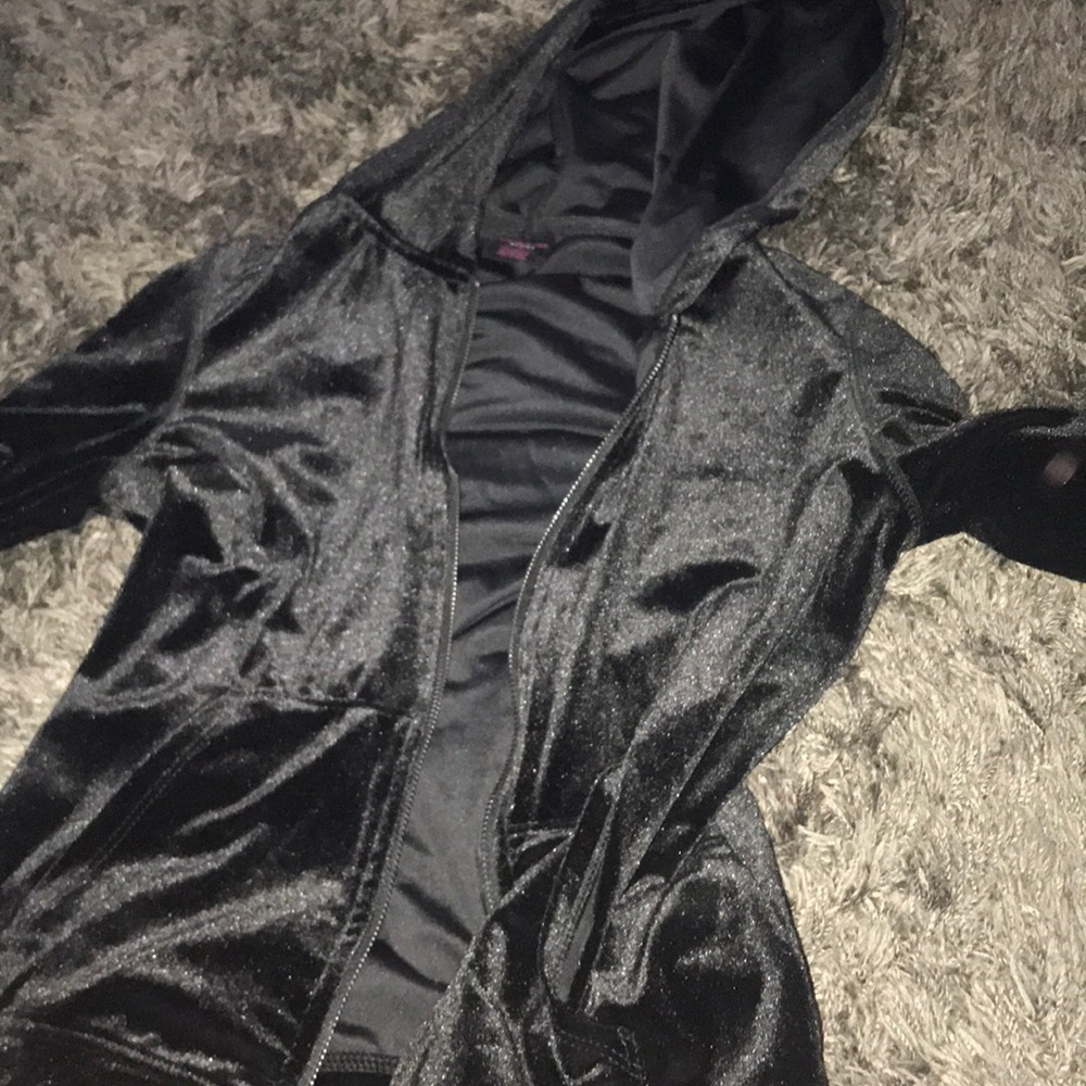 Black jacket with cross cross arms